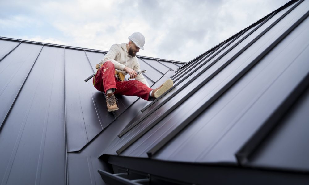 full-shot-man-working-roof-min