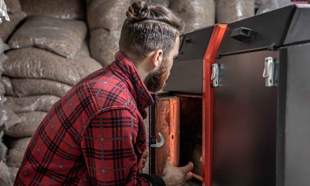 man-room-with-solid-fuel-boiler-working-biofuel-economical-heating (1)